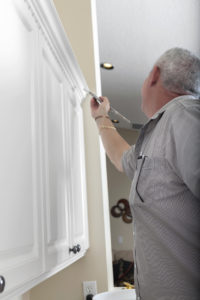 "Real situation, carpenter painting cabinet trimBuilding and Construction"